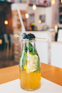 Bottle of natural juice on table