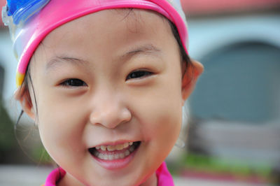 Close-up portrait of cute girl smiling