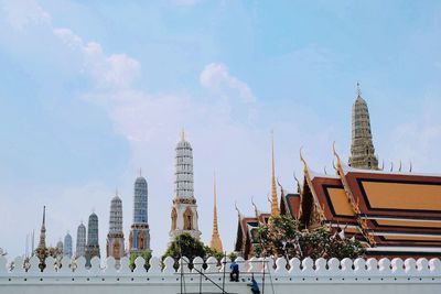 Panoramic view of buildings in city against sky