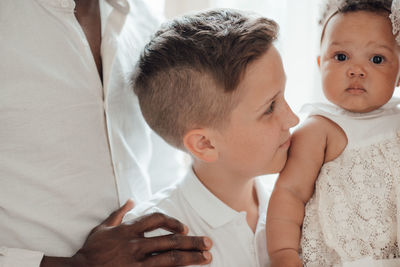 Midsection of couple kissing