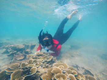 People swimming in sea