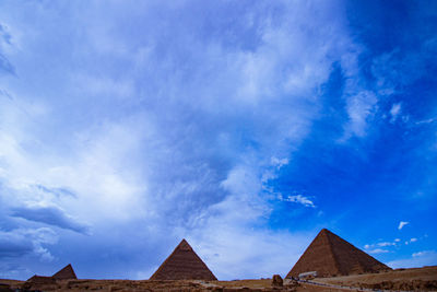 Low angle view of historical building against blue sky
