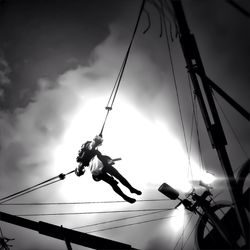 Low angle view of person jumping on bungee jumping