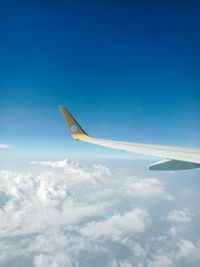 Low angle view of airplane flying in sky