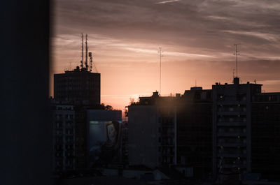 Cityscape against sky during sunset