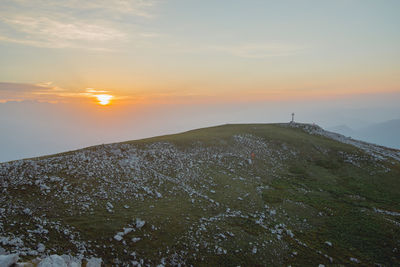 Scenic view of mountains against sky during sunset