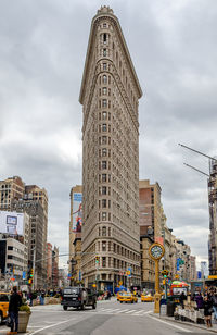 Low angle view of buildings in city against sky