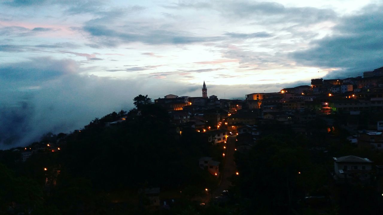 AERIAL VIEW OF ILLUMINATED CITY AGAINST SKY AT NIGHT