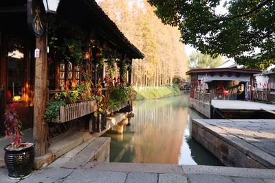 Gazebo over canal by trees