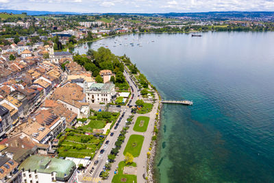 High angle view of buildings and sea in town