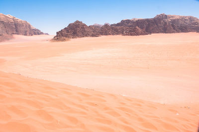 Scenic view of desert against clear sky