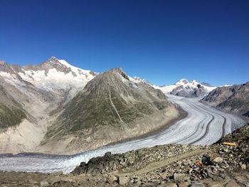 Scenic view of mountains against clear blue sky