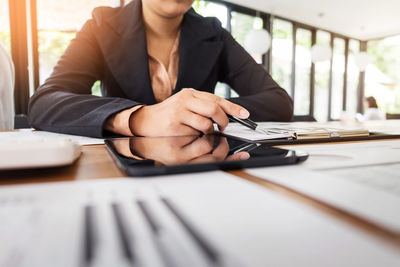Close-up of woman working on table