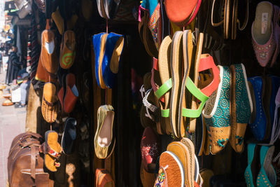 Typical moroccan style shoes and sandals hanging for sale, essaouira, morocco.