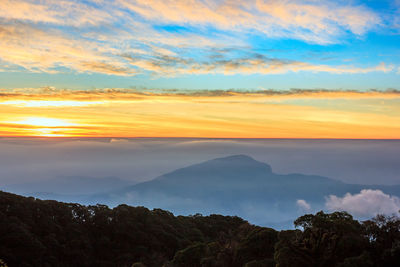 Scenic view of mountains against sky during sunset