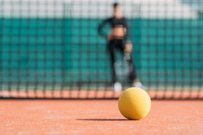 Woman playing tennis in court