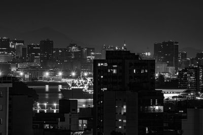 High angle view of illuminated buildings in city at night