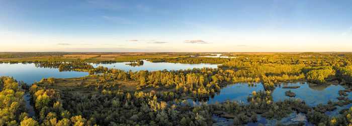 Aerial scenic view of lake against sky at sunset