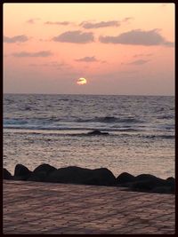 Scenic view of sea at sunset