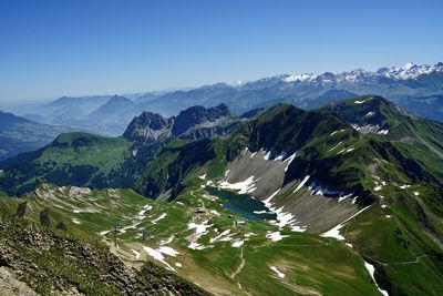 High angle view of mountains against clear blue sky