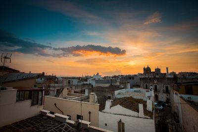 High angle view of townscape against sky at sunset