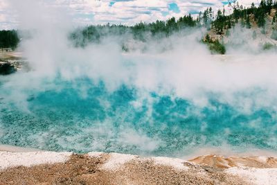 Aerial view of blue river during foggy weather at yellowstone national park