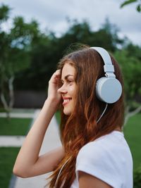 Portrait of smiling young woman looking away