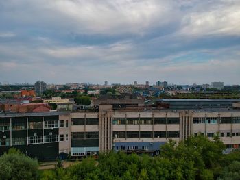 High angle view of buildings in city against sky