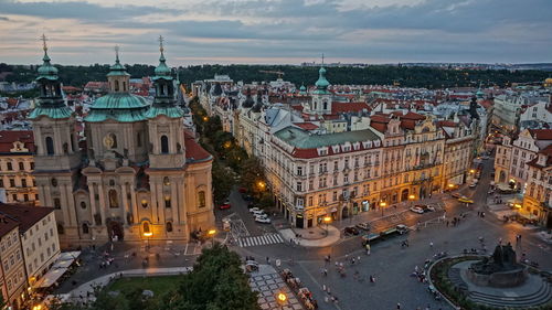 High angle view of illuminated st nicholas church against cloudy sky at dusk