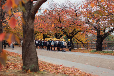 Group of people in park during autumn