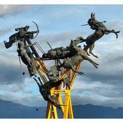 Low angle view of statue against sky