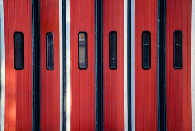 Close up of folding red doors