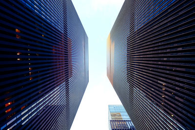 Low angle view of modern buildings against sky