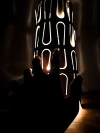 Close-up of illuminated candles on table