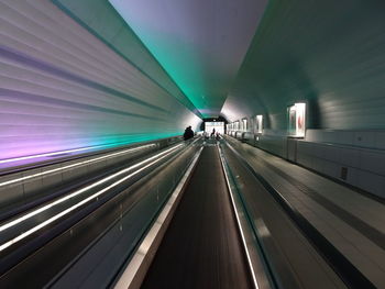 Illuminated tunnel at airport