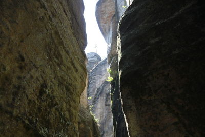 Low angle view of person on rock formation