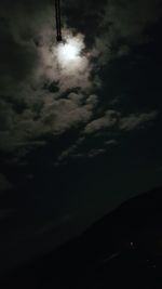 Low angle view of moon in sky at night