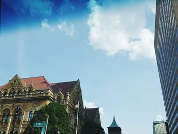 Low angle view of buildings against blue sky