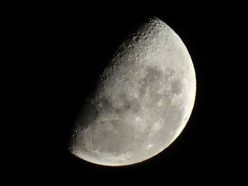 Low angle view of moon against clear sky at night