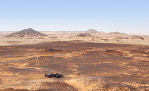 Scenic view of desert against clear sky