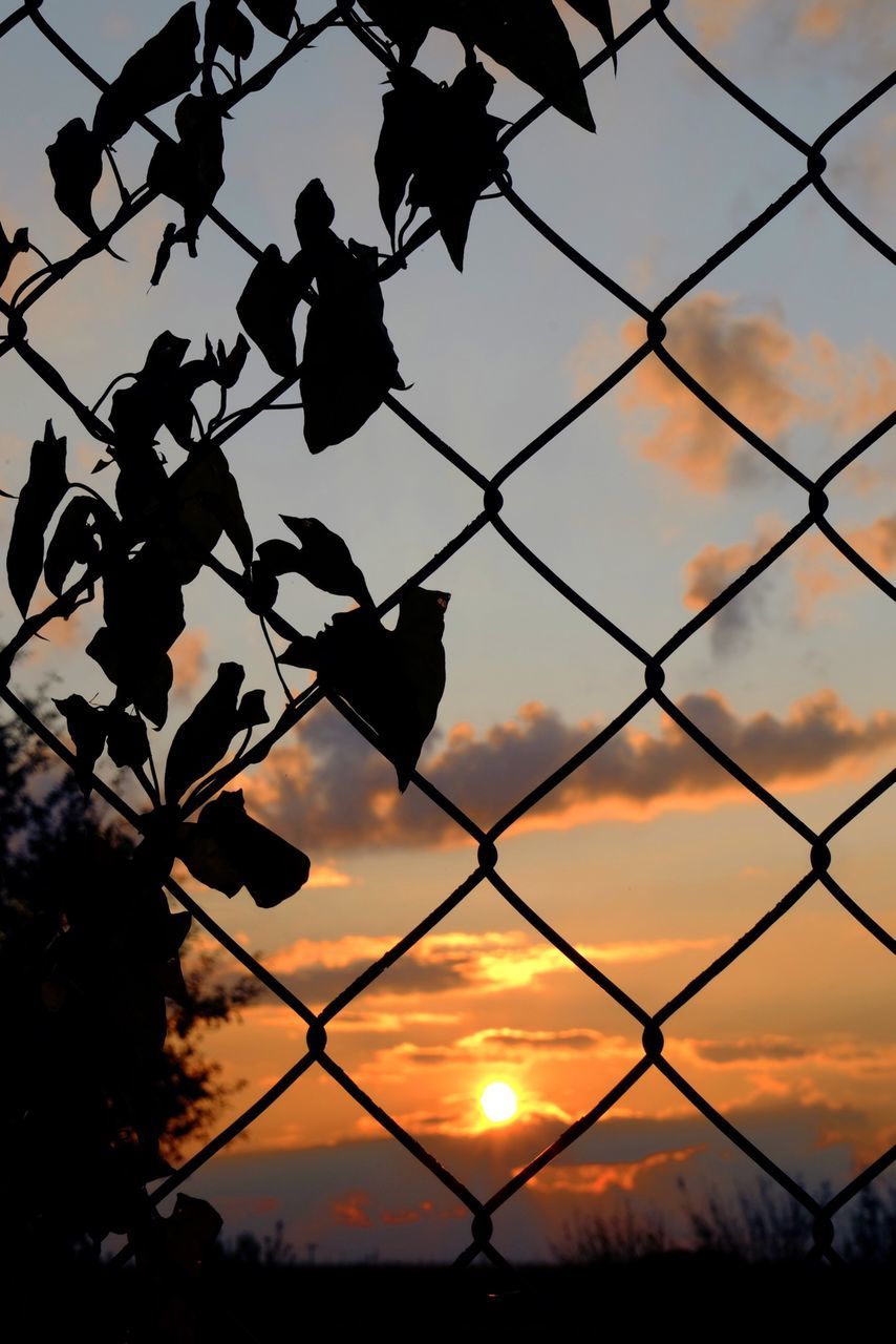 sunset, chainlink fence, fence, silhouette, sky, protection, safety, security, orange color, cloud - sky, barbed wire, beauty in nature, nature, scenics, tranquility, metal, power line, sun, electricity pylon, no people