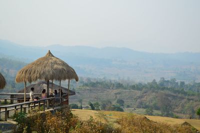 Built structure on landscape against the sky