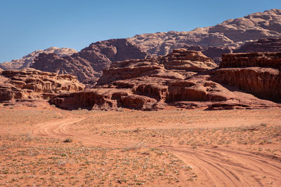 Scenic view of arid landscape against clear sky