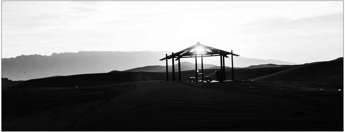 Lifeguard hut on mountain against sky