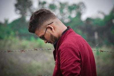 A man with stylish haircut and cool beard.