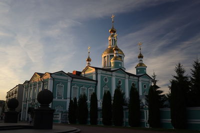 View of temple building against cloudy sky