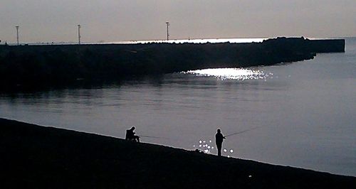 Silhouette of people at sunset