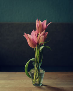 Close-up of pink flower in vase on table