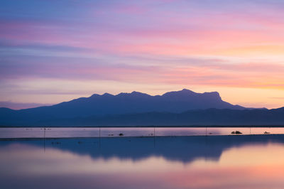 A rare sight of the salt flats in guadalupe mountain national park flooding with a colorful sky