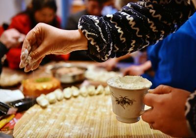 Close-up of hand preparing food